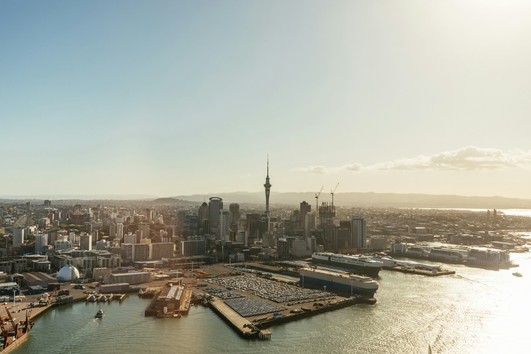 Aerial view of Auckland city and the Waitematā Harbour at sunset